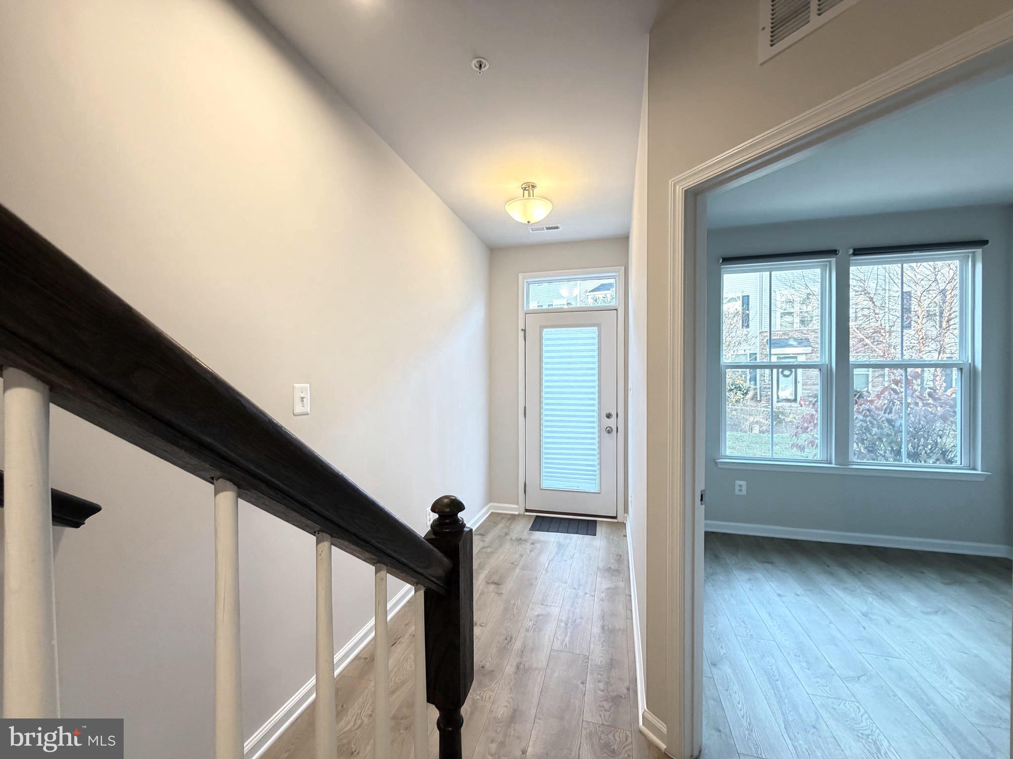 1325 Bruley Road Hanover, MD 21076 - Photo 3 of 22 a view of an entryway with wooden floor and door