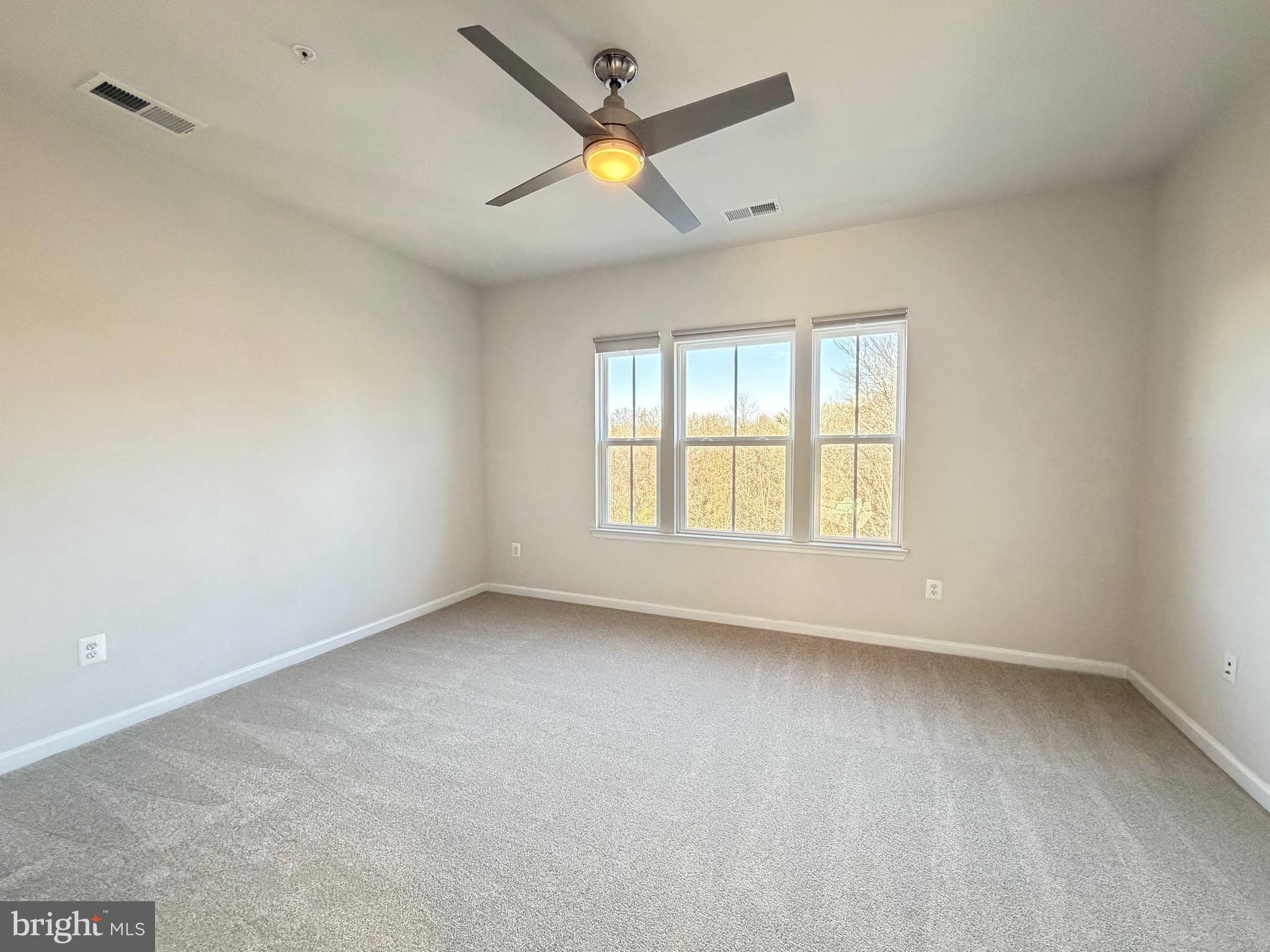 1325 Bruley Road Hanover, MD 21076 - Photo 10 of 22 an empty room with a window and a fan