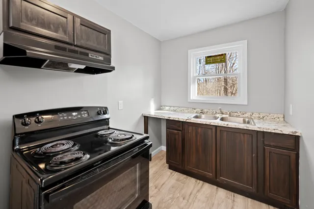 a kitchen with a stove and a microwave