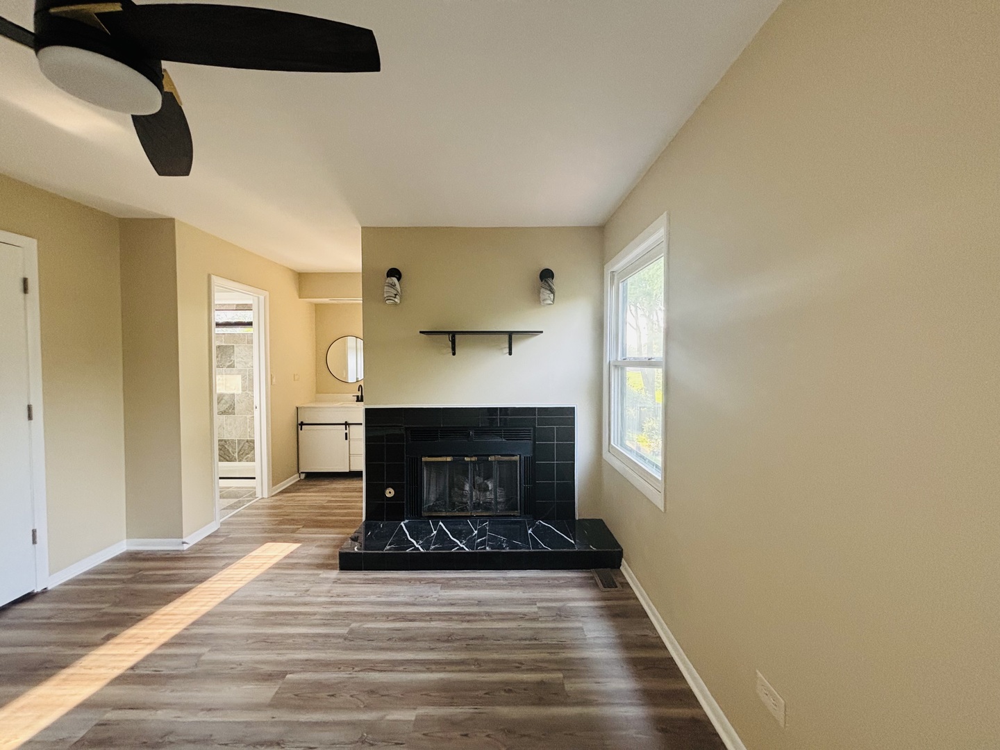 325 Shadow Bend Drive Wheeling, IL 60090 - Photo 13 of 26 a living room with furniture and a fireplace