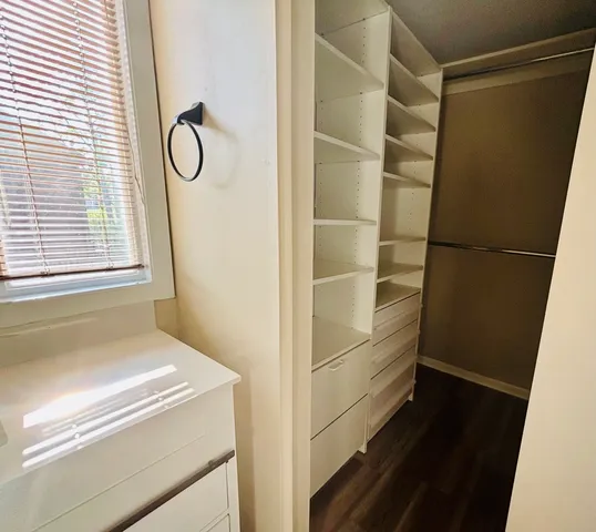 a bathroom with a bathtub and a window