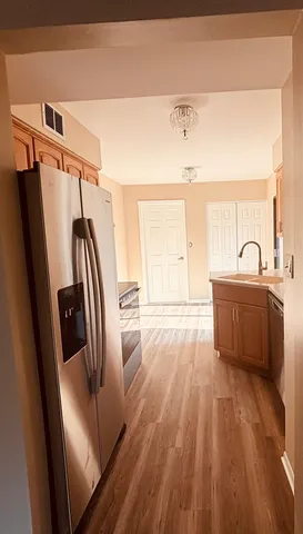 a bathroom with a sink a mirror a bathtub and shower