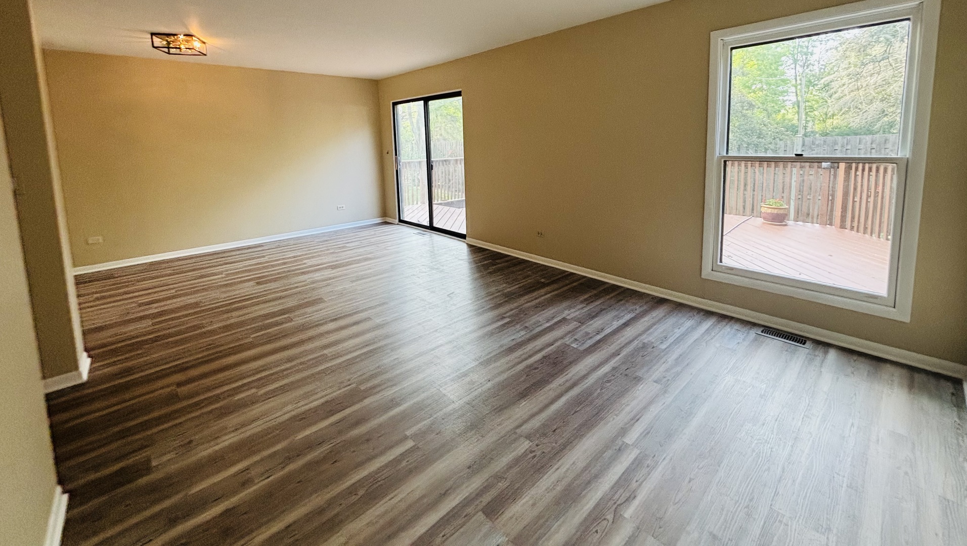 325 Shadow Bend Drive Wheeling, IL 60090 - Photo 10 of 26 a view of an empty room with wooden floor and a window