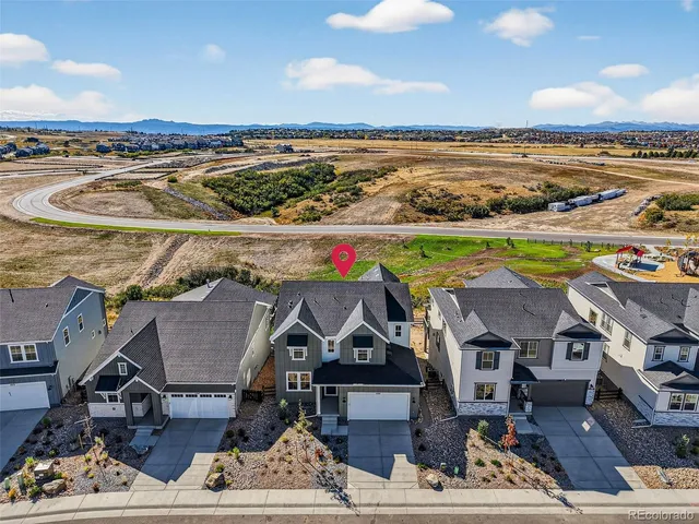 an aerial view of a house with a ocean view