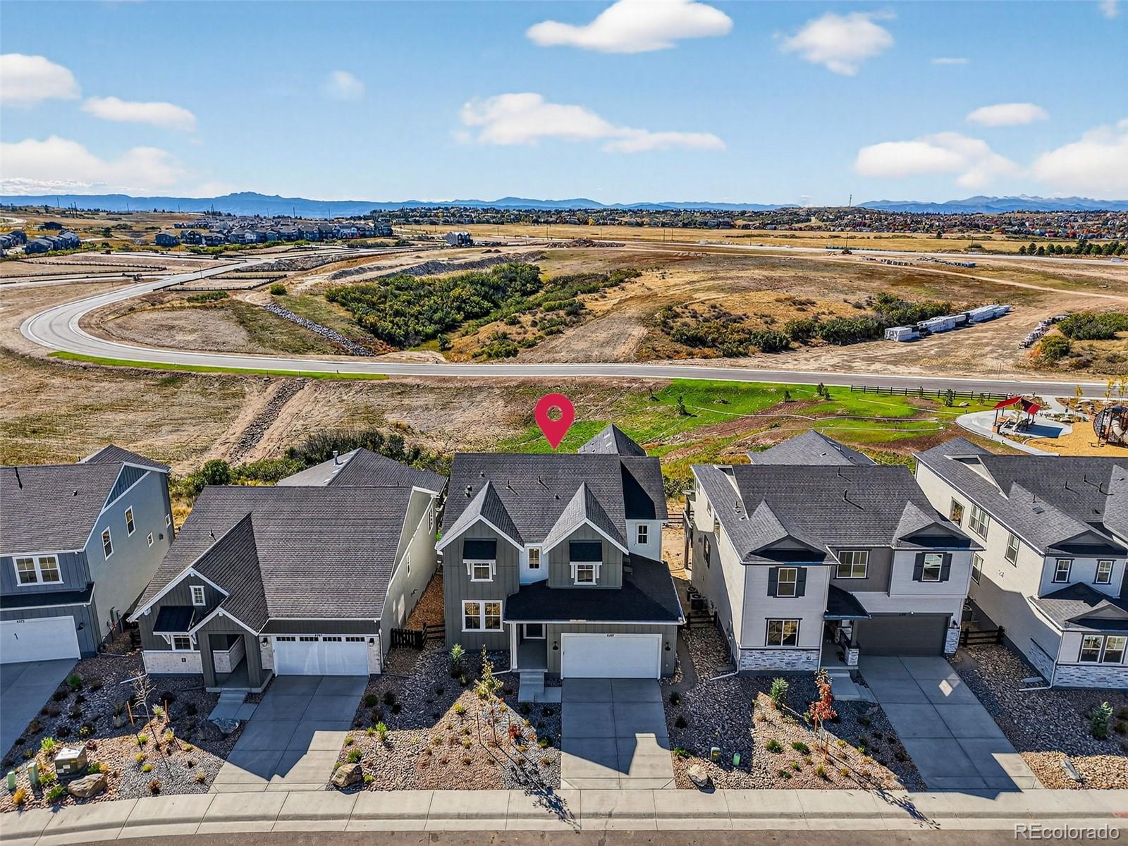 an aerial view of a house with a ocean view