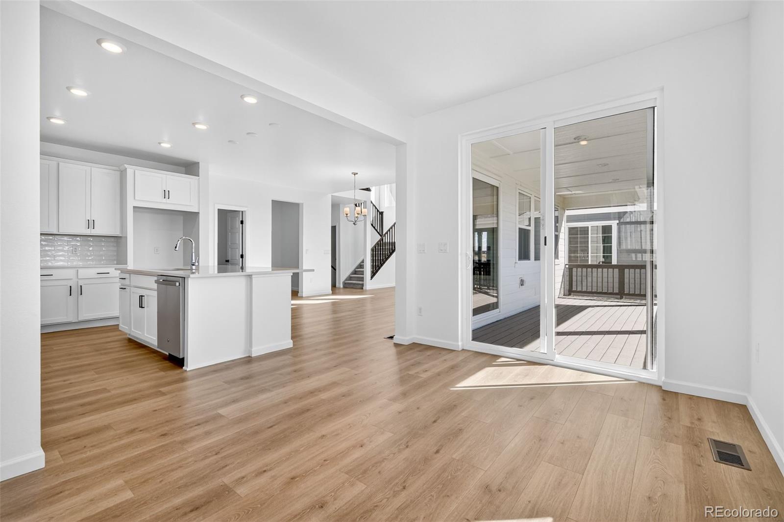 4297 Ridgewalk Point Castle Rock, CO 80108 - Photo 16 of 50 a view of kitchen with cabinets and wooden floor