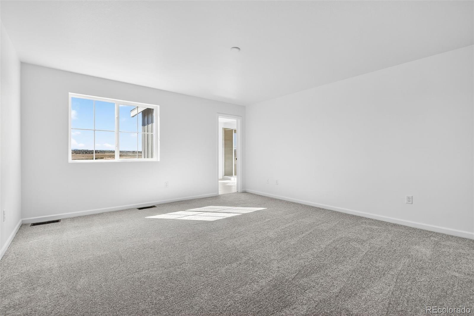 4297 Ridgewalk Point Castle Rock, CO 80108 - Photo 22 of 50 an empty room with a empty space and windows