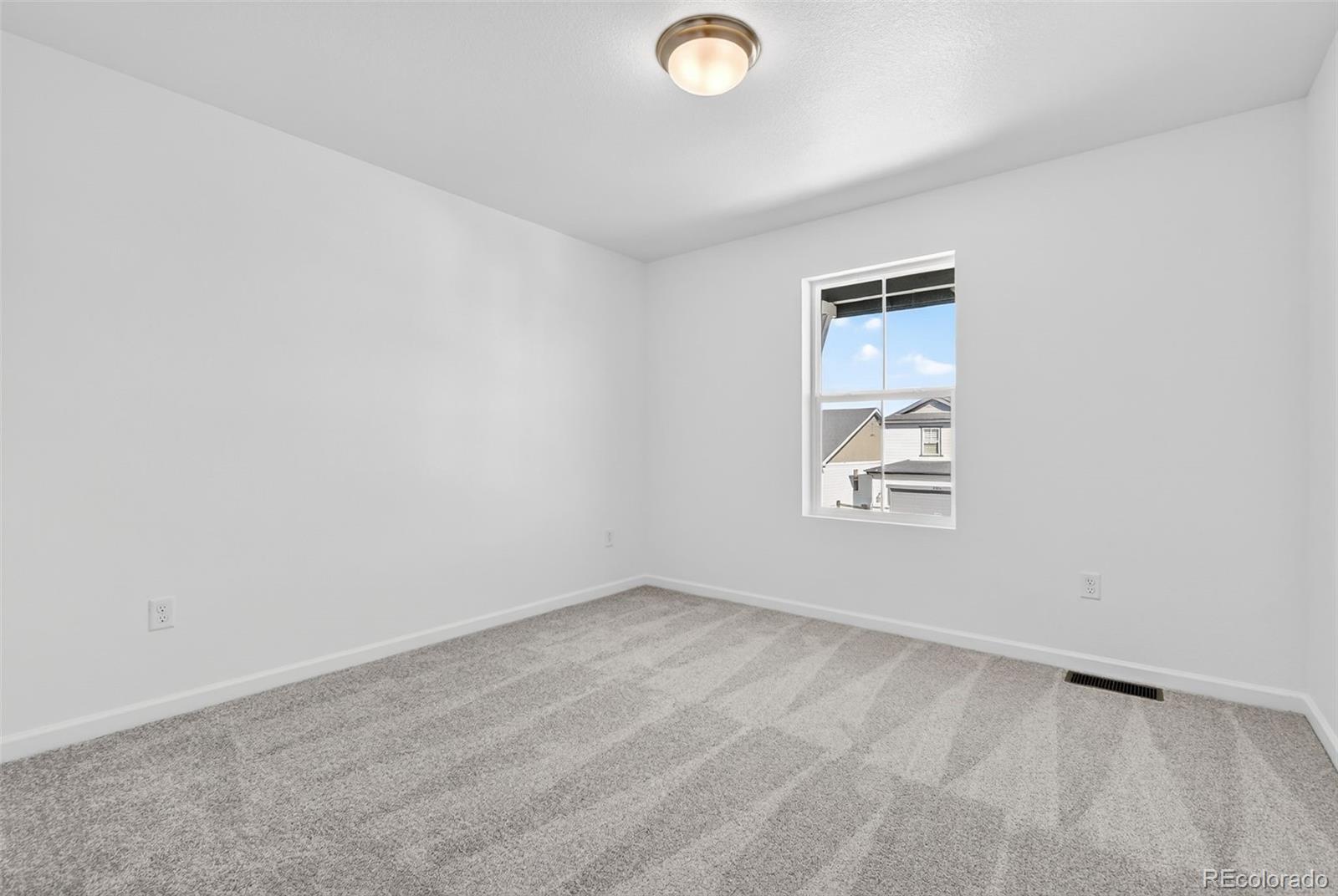 4297 Ridgewalk Point Castle Rock, CO 80108 - Photo 26 of 50 an empty room with windows