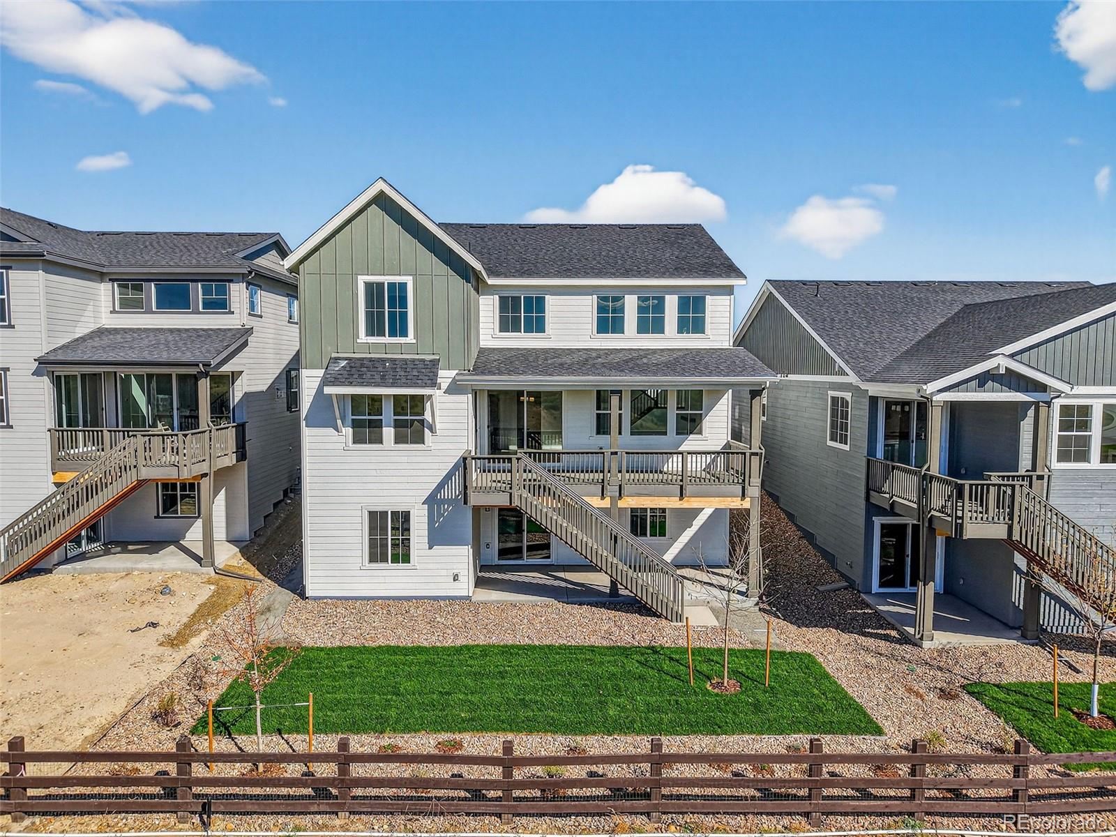 4297 Ridgewalk Point Castle Rock, CO 80108 - Photo 31 of 50 a front view of a house with a yard