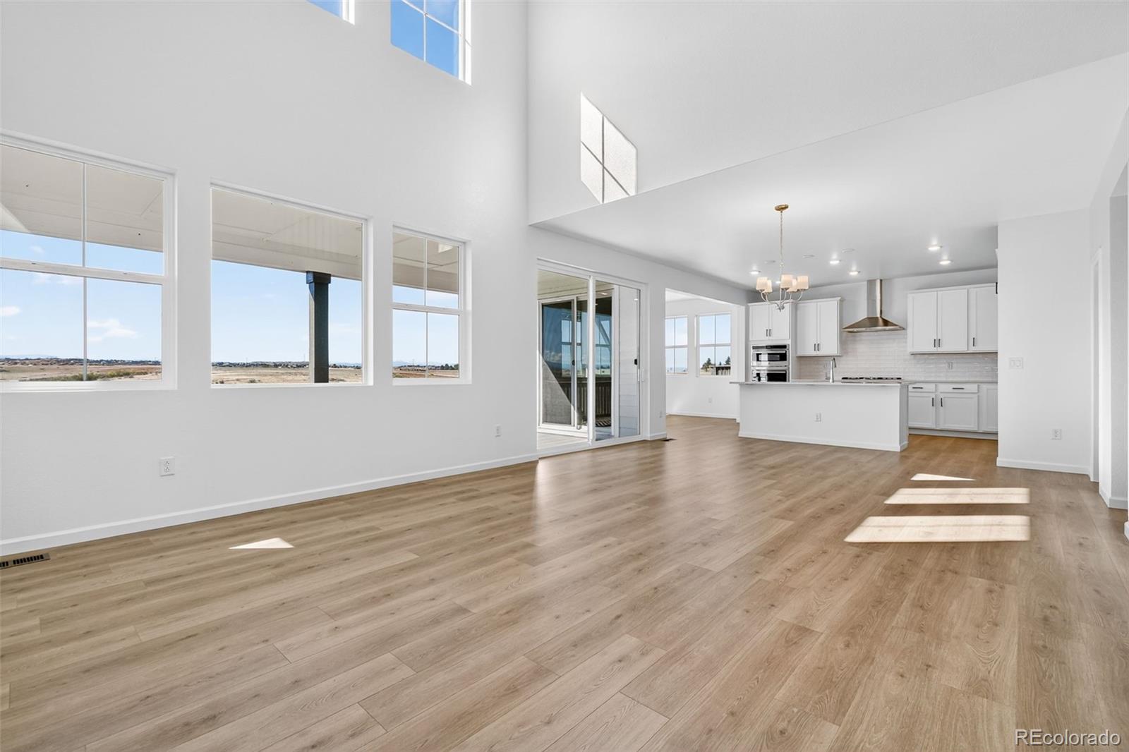 4297 Ridgewalk Point Castle Rock, CO 80108 - Photo 5 of 50 a view of kitchen with cabinets and wooden floor