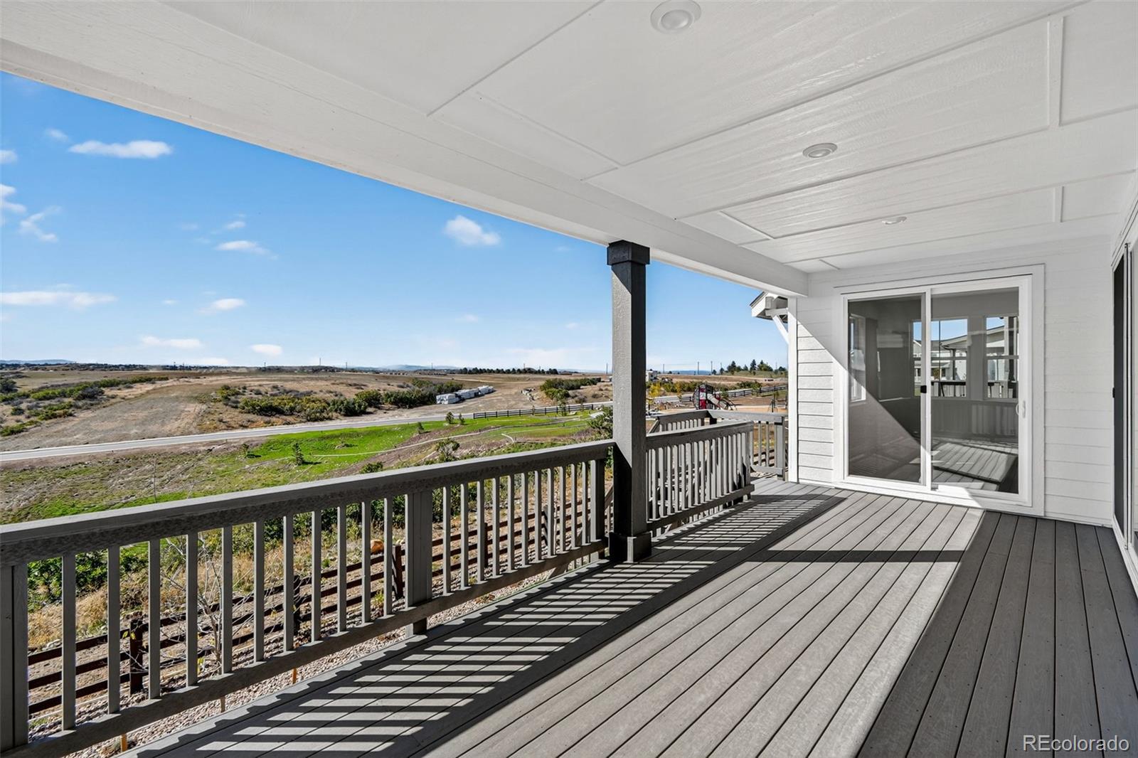 4297 Ridgewalk Point Castle Rock, CO 80108 - Photo 8 of 50 a view of a balcony with wooden floor