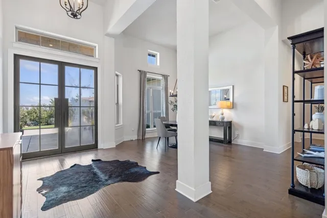 a living room with furniture and a book shelf
