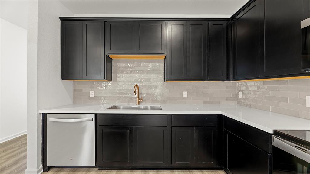 2516 YO Rnch Road Anna, TX 75409 - Photo 7 of 30 a kitchen with a sink and cabinets