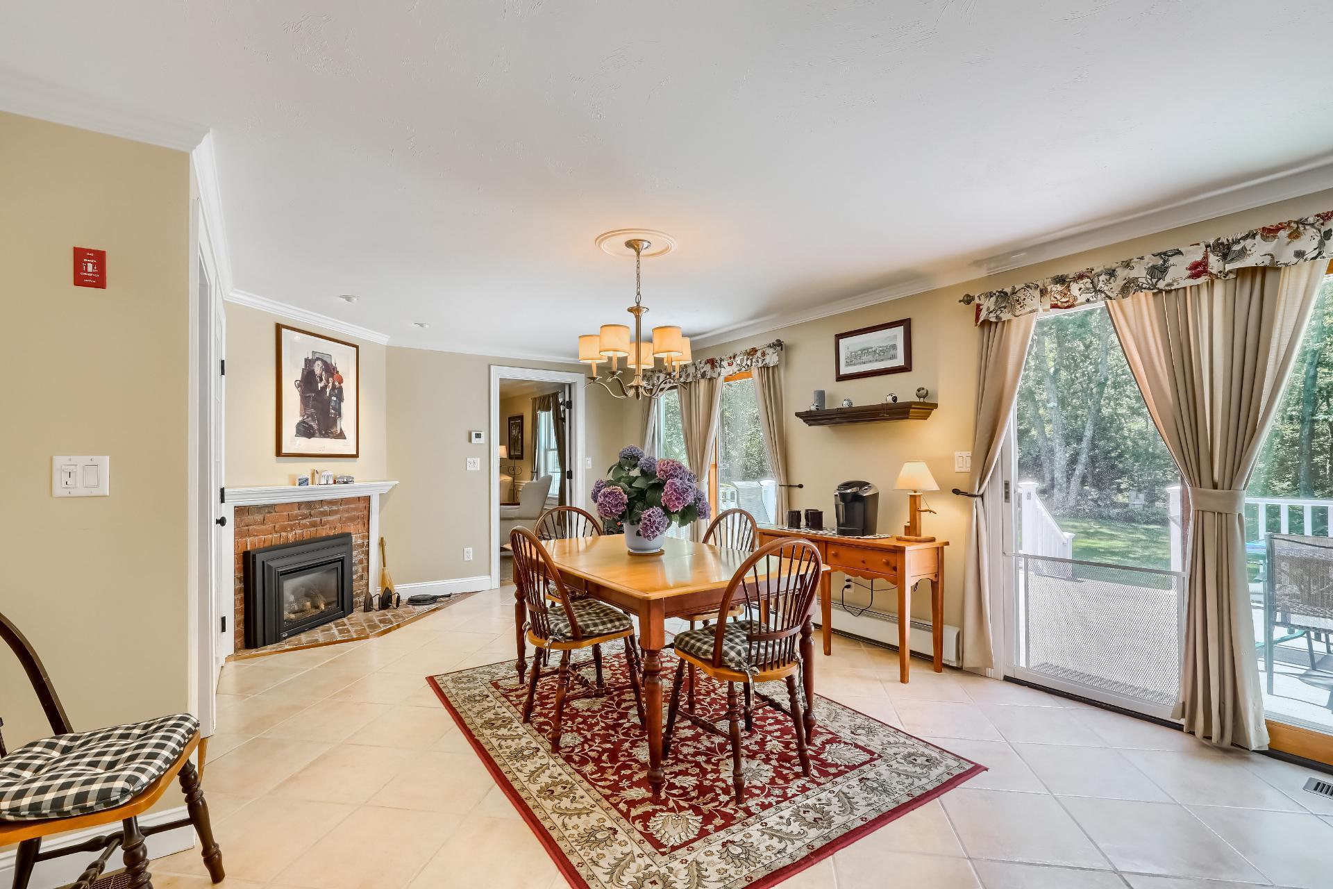 279 Service Road East Sandwich, MA 02537 - Photo 12 of 44 a view of a dining room with furniture window and wooden floor