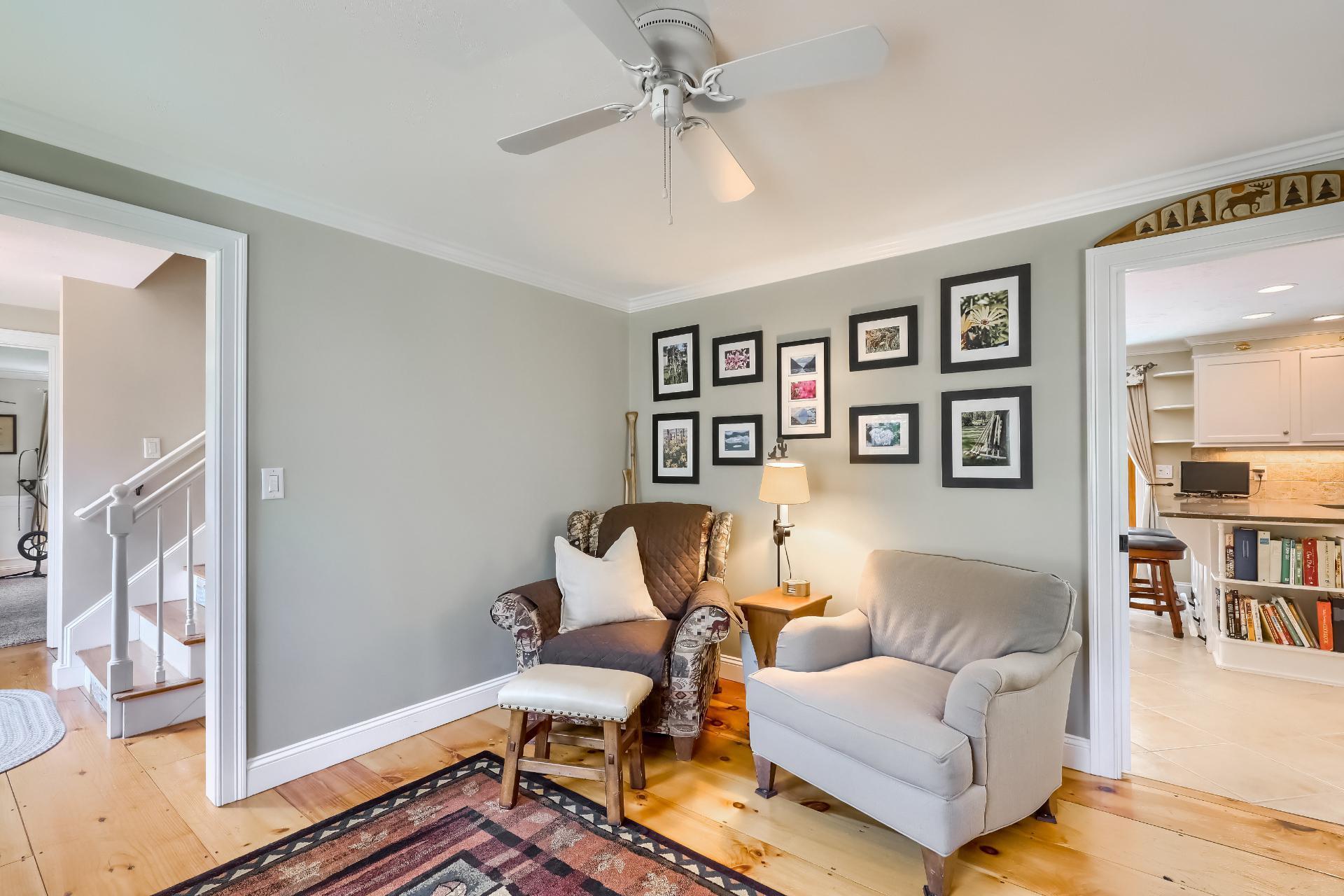 279 Service Road East Sandwich, MA 02537 - Photo 14 of 44 a living room with furniture and a bookshelf