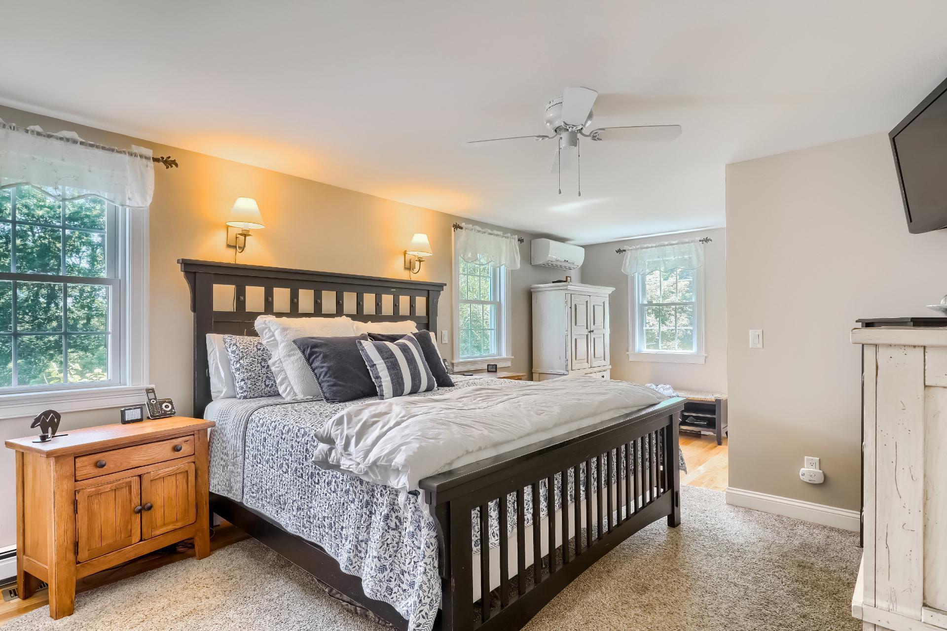 279 Service Road East Sandwich, MA 02537 - Photo 16 of 44 a bedroom with a bed and a dresser