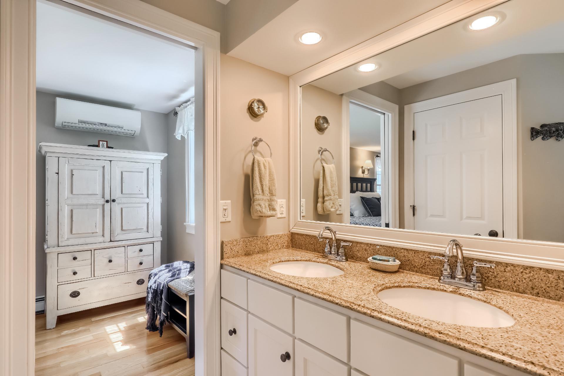 279 Service Road East Sandwich, MA 02537 - Photo 19 of 44 a en suite bathroom with a granite countertop tub sink and mirror