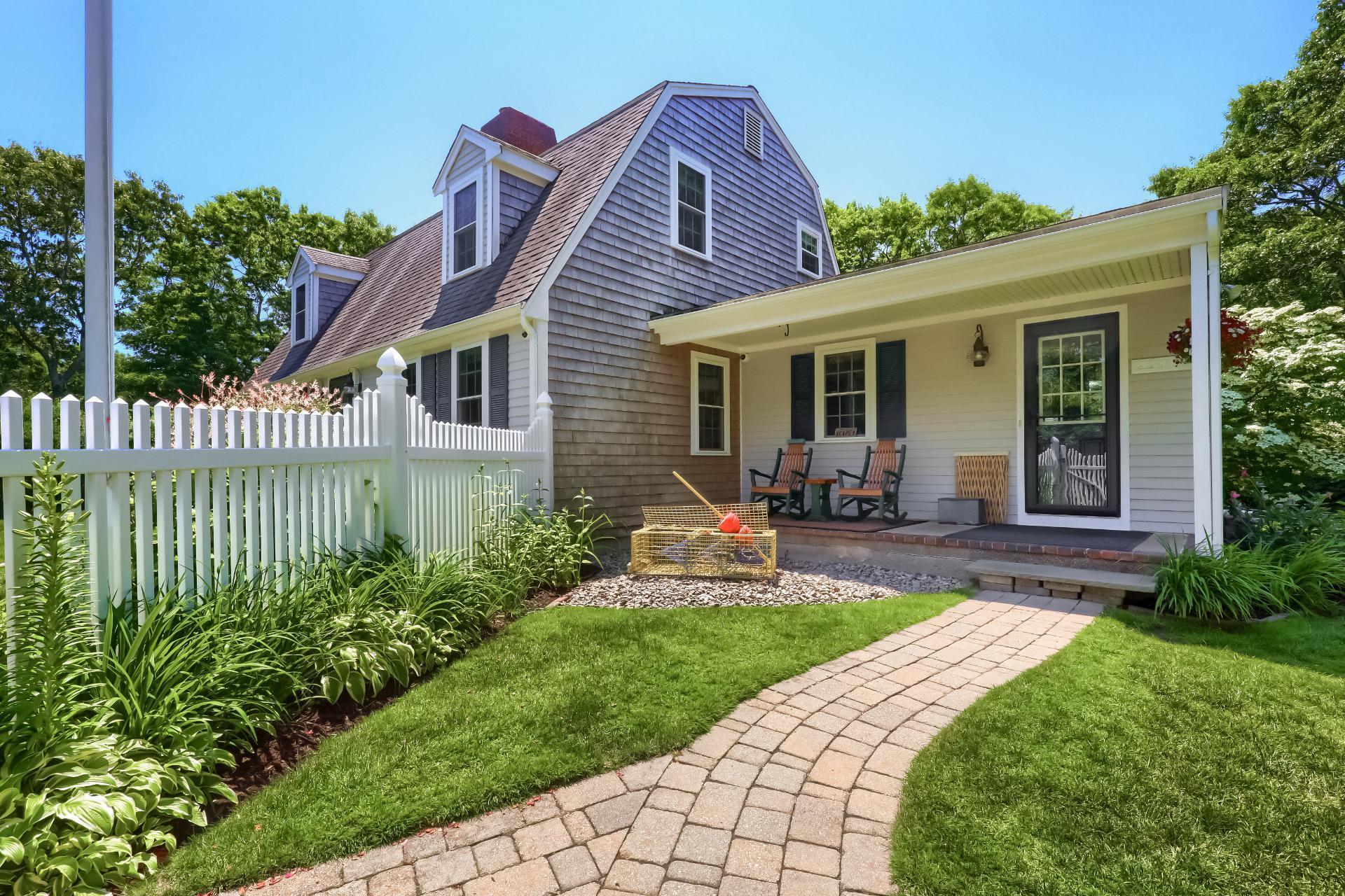 279 Service Road East Sandwich, MA 02537 - Photo 33 of 44 a front view of a house with a yard and porch