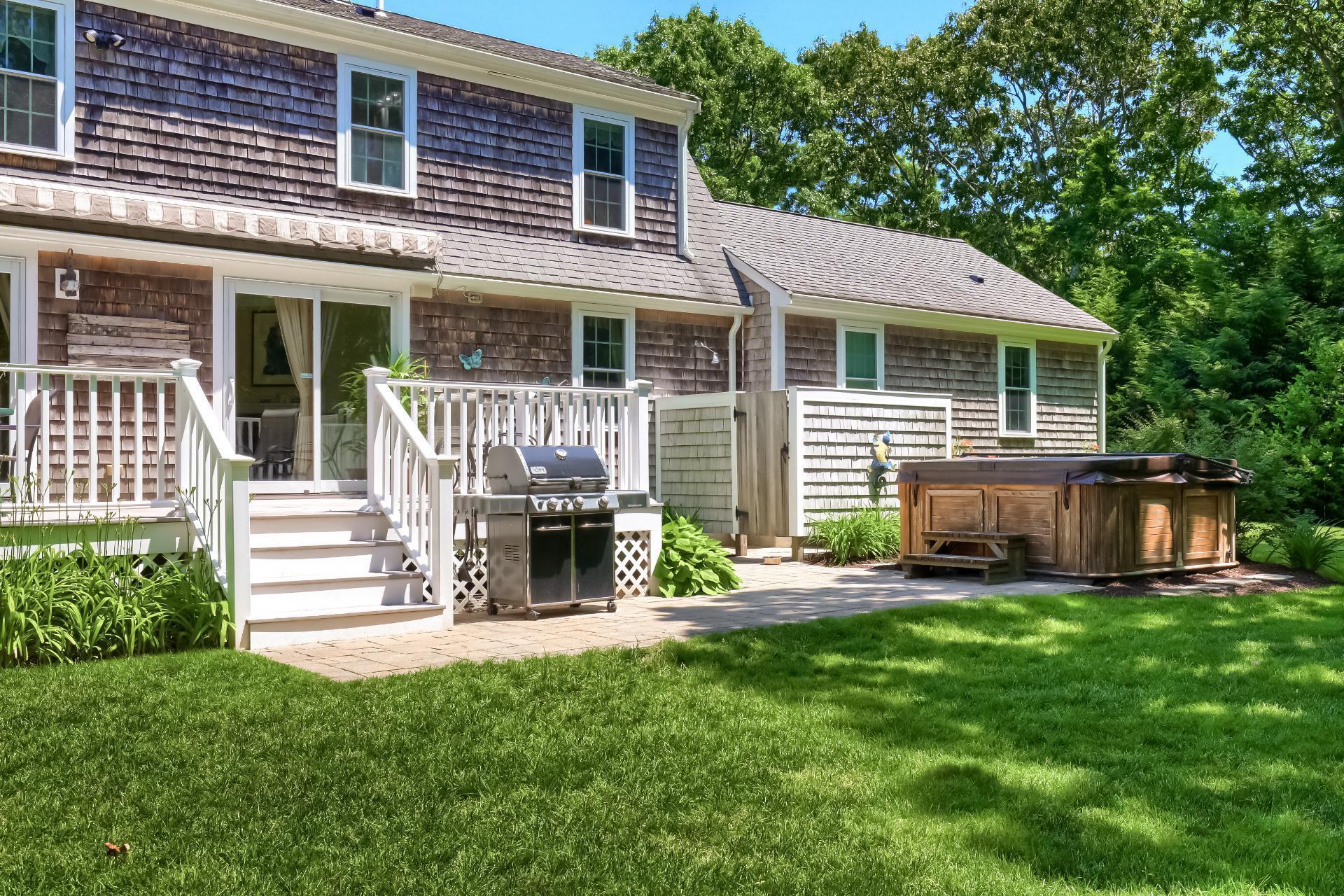 279 Service Road East Sandwich, MA 02537 - Photo 34 of 44 a view of a house with a yard and sitting area