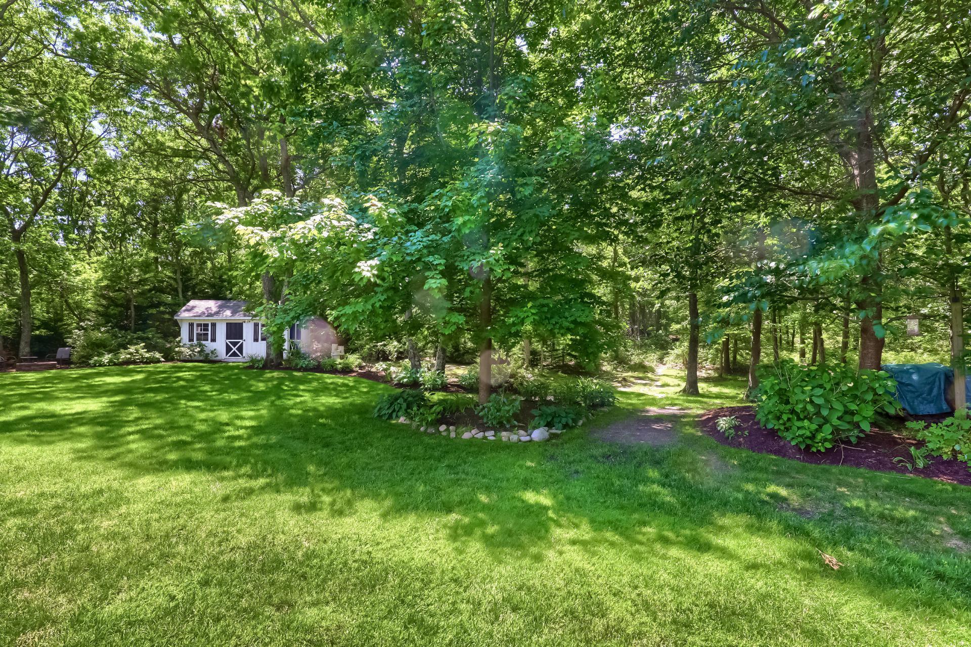 279 Service Road East Sandwich, MA 02537 - Photo 38 of 44 a view of a backyard with a garden