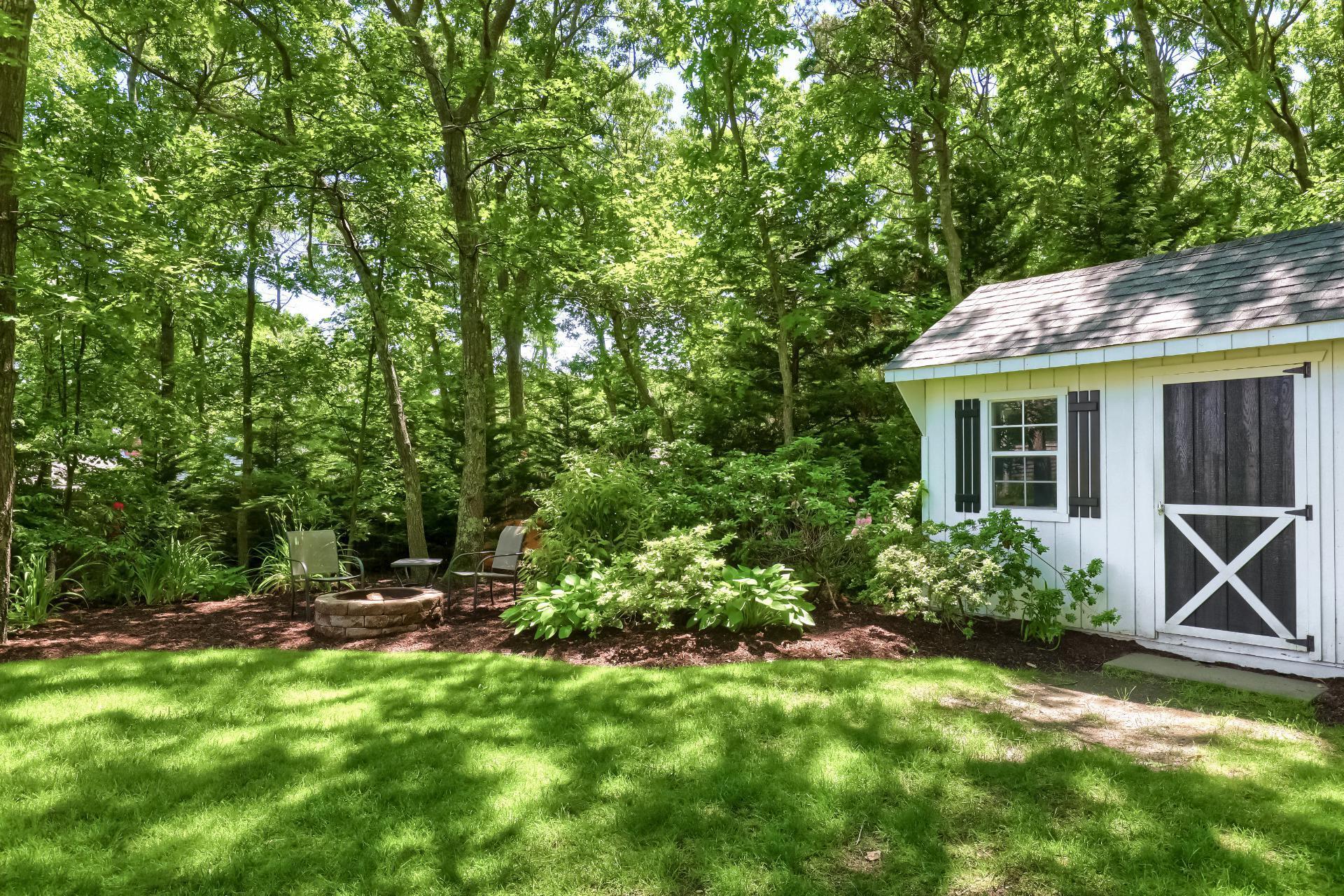 279 Service Road East Sandwich, MA 02537 - Photo 39 of 44 a view of house with backyard and outdoor seating