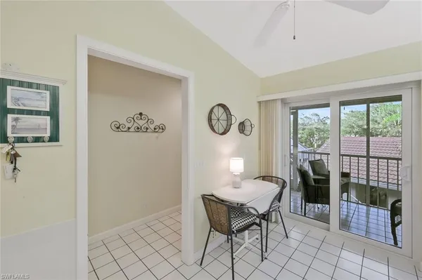 a dining room with furniture and window