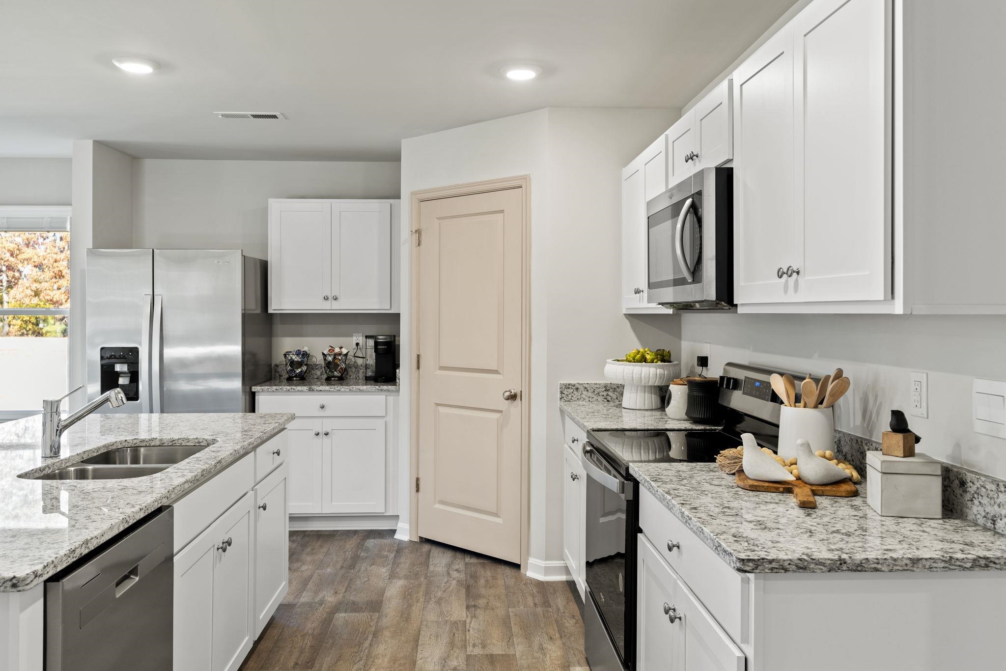 403 Stonewall Jackson Boulevard Staunton, VA 24401 - Photo 5 of 25 a kitchen with stainless steel appliances granite countertop a sink stove and refrigerator