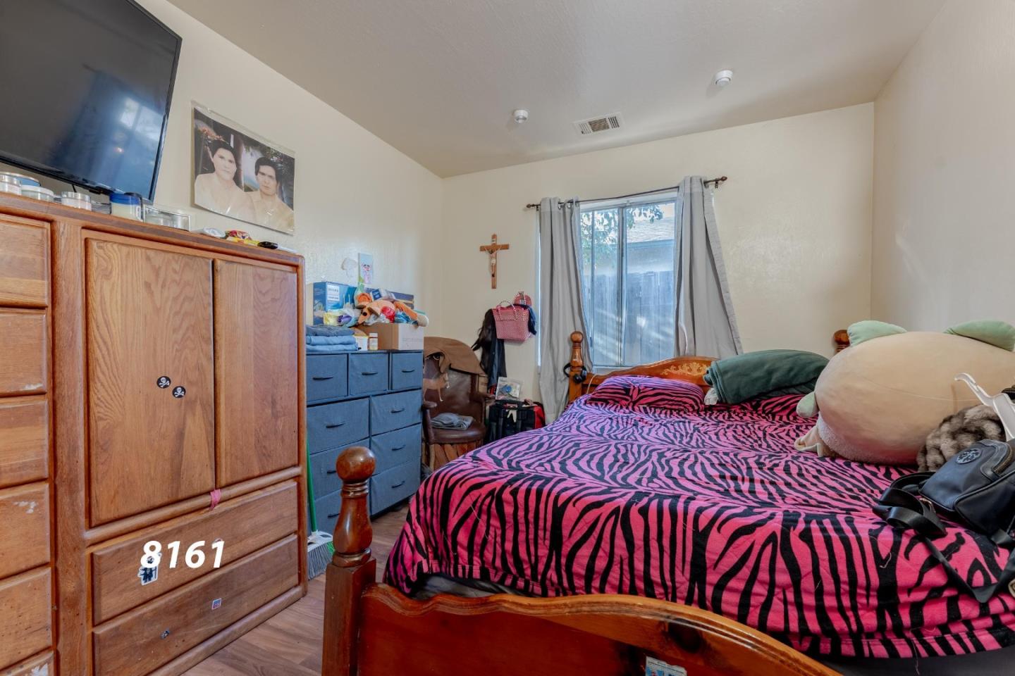 8151 Forest Street Gilroy, CA 95020 - Photo 11 of 43 a bedroom with bed and wooden floor