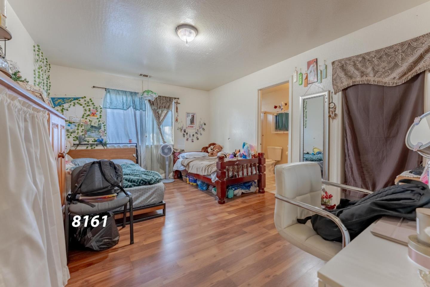8151 Forest Street Gilroy, CA 95020 - Photo 15 of 43 a living room with furniture and a wooden floor