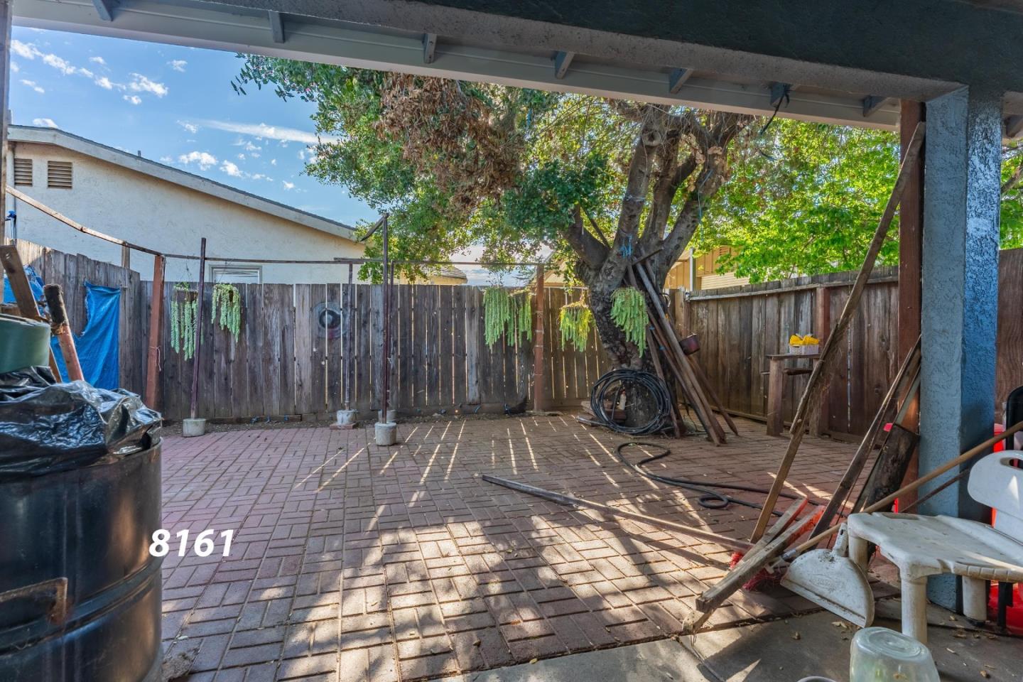 8151 Forest Street Gilroy, CA 95020 - Photo 17 of 43 a view of a backyard with furniture and wooden deck