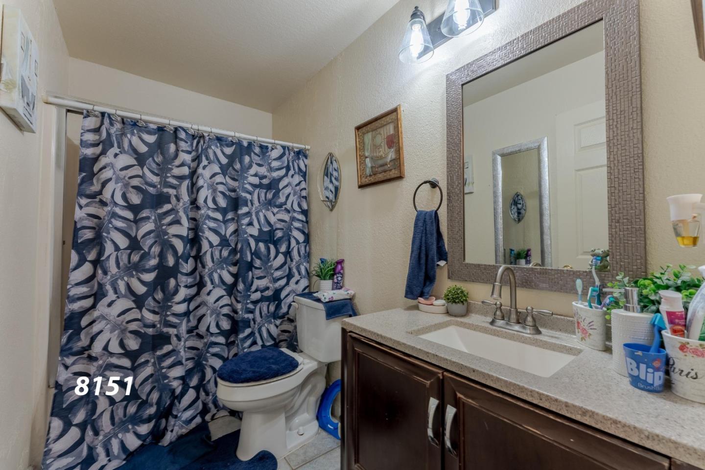 8151 Forest Street Gilroy, CA 95020 - Photo 22 of 43 a bathroom with a sink and a mirror