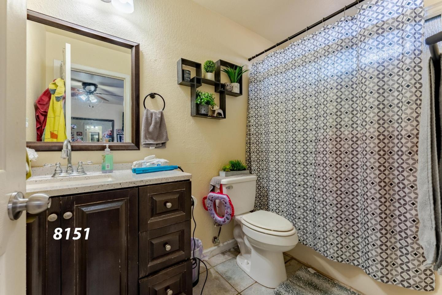 8151 Forest Street Gilroy, CA 95020 - Photo 24 of 43 a bathroom with a toilet and a sink