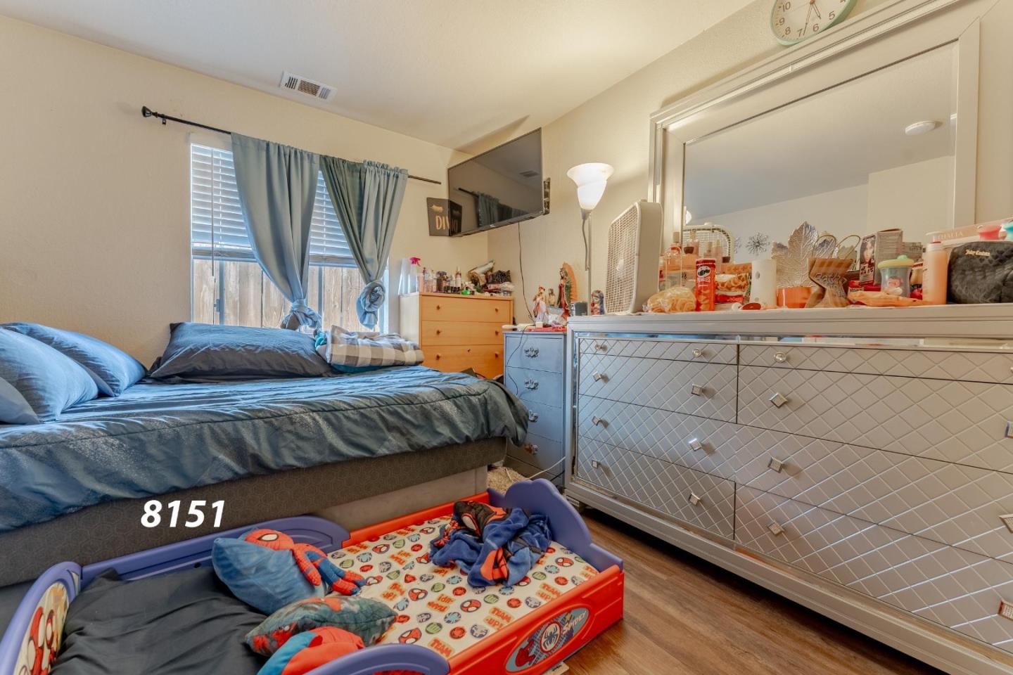 8151 Forest Street Gilroy, CA 95020 - Photo 26 of 43 a bedroom with a bed window and dresser