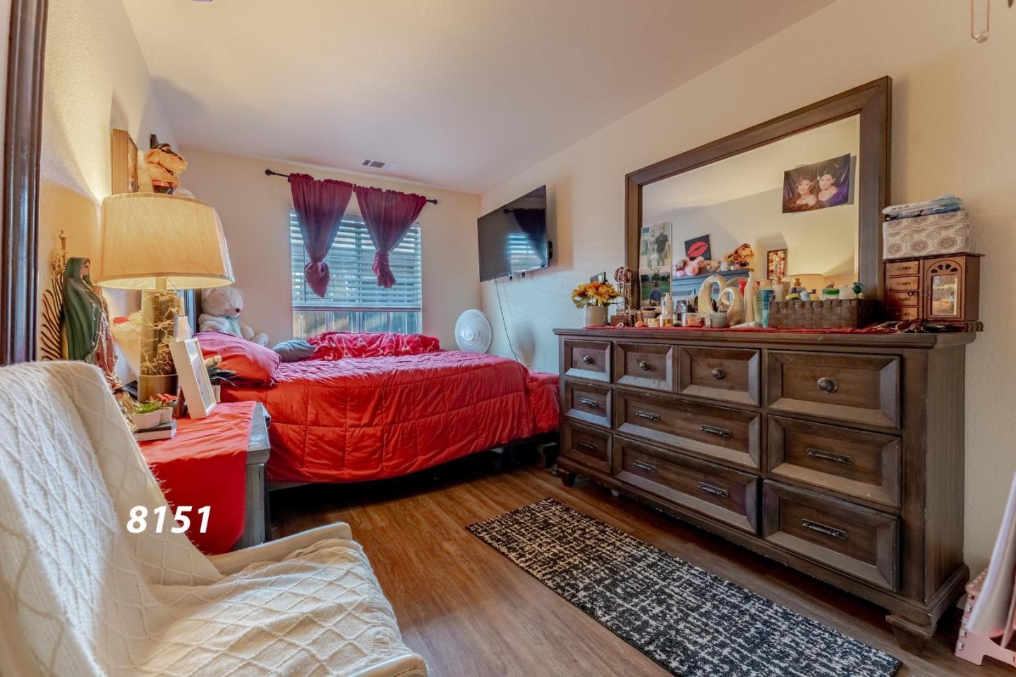 8151 Forest Street Gilroy, CA 95020 - Photo 28 of 43 a bedroom with furniture and a mirror