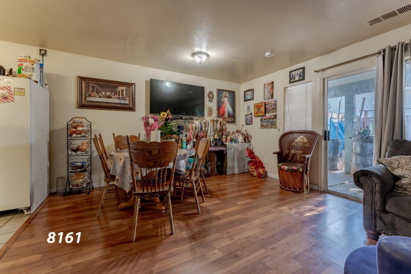 8151 Forest Street Gilroy, CA 95020 - Photo 3 of 43 a view of a dining room with furniture and wooden floor