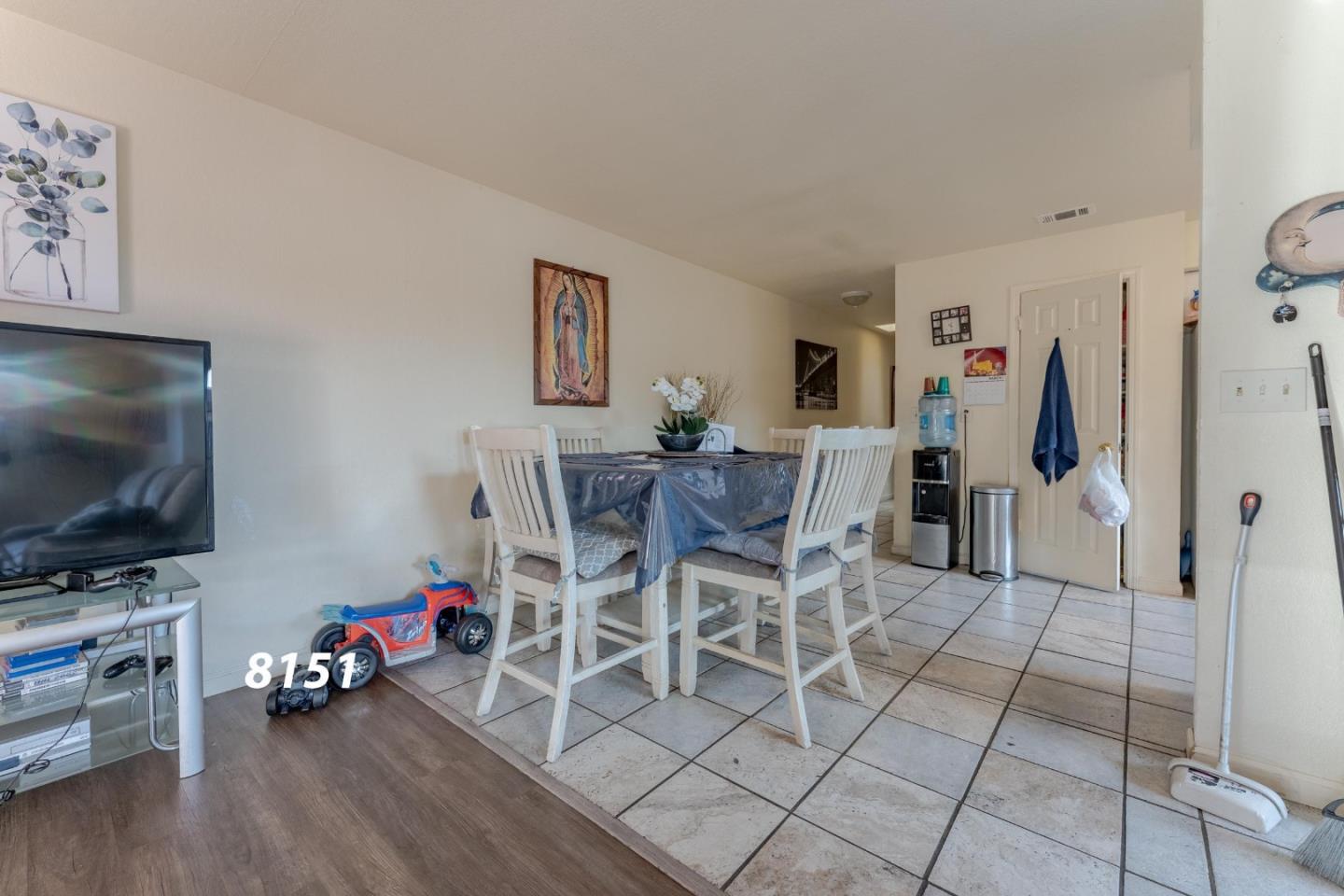 8151 Forest Street Gilroy, CA 95020 - Photo 33 of 43 a view of a livingroom with furniture and a flat screen tv
