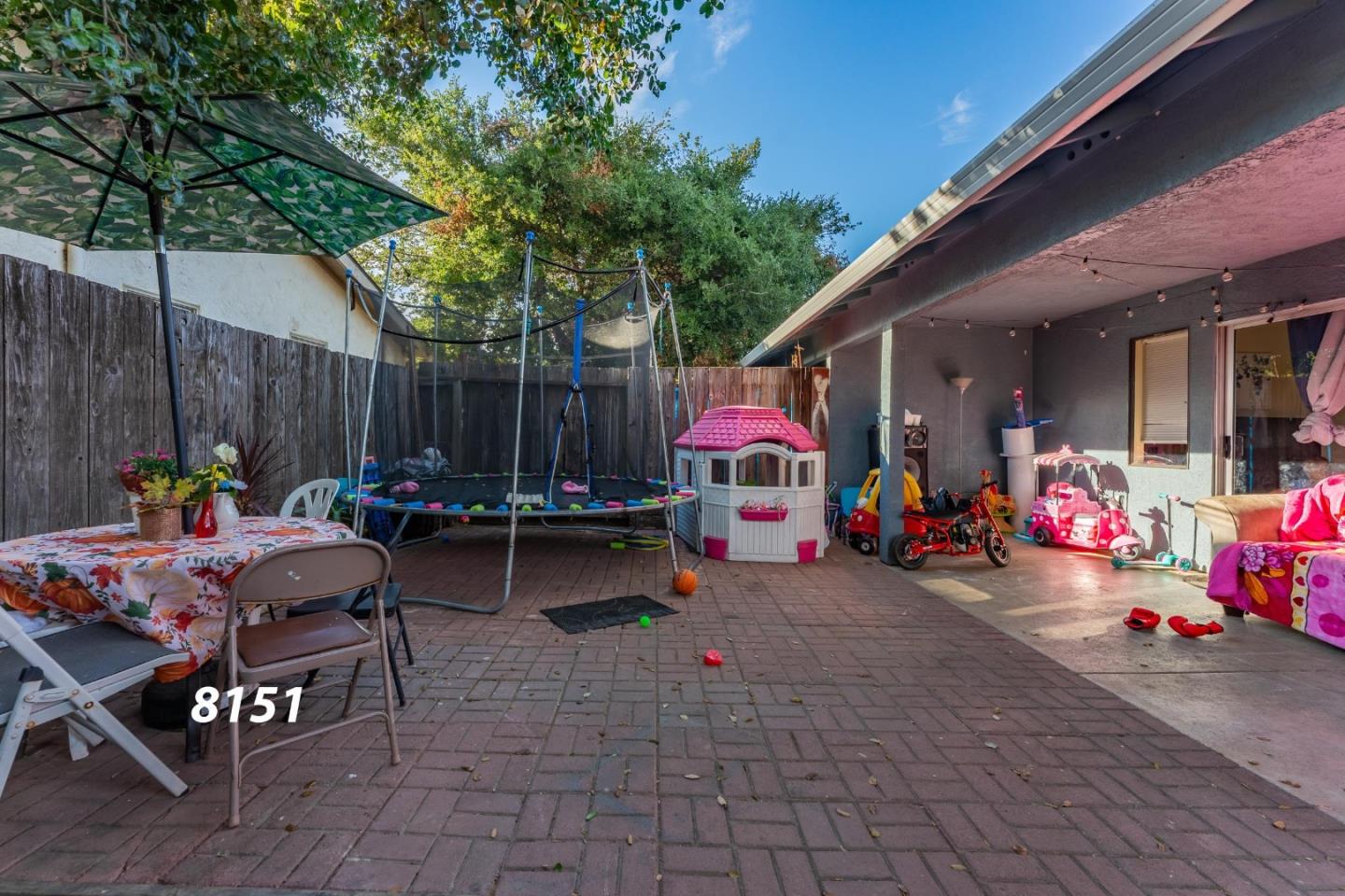 8151 Forest Street Gilroy, CA 95020 - Photo 34 of 43 a view of a patio with table and chairs and potted plants