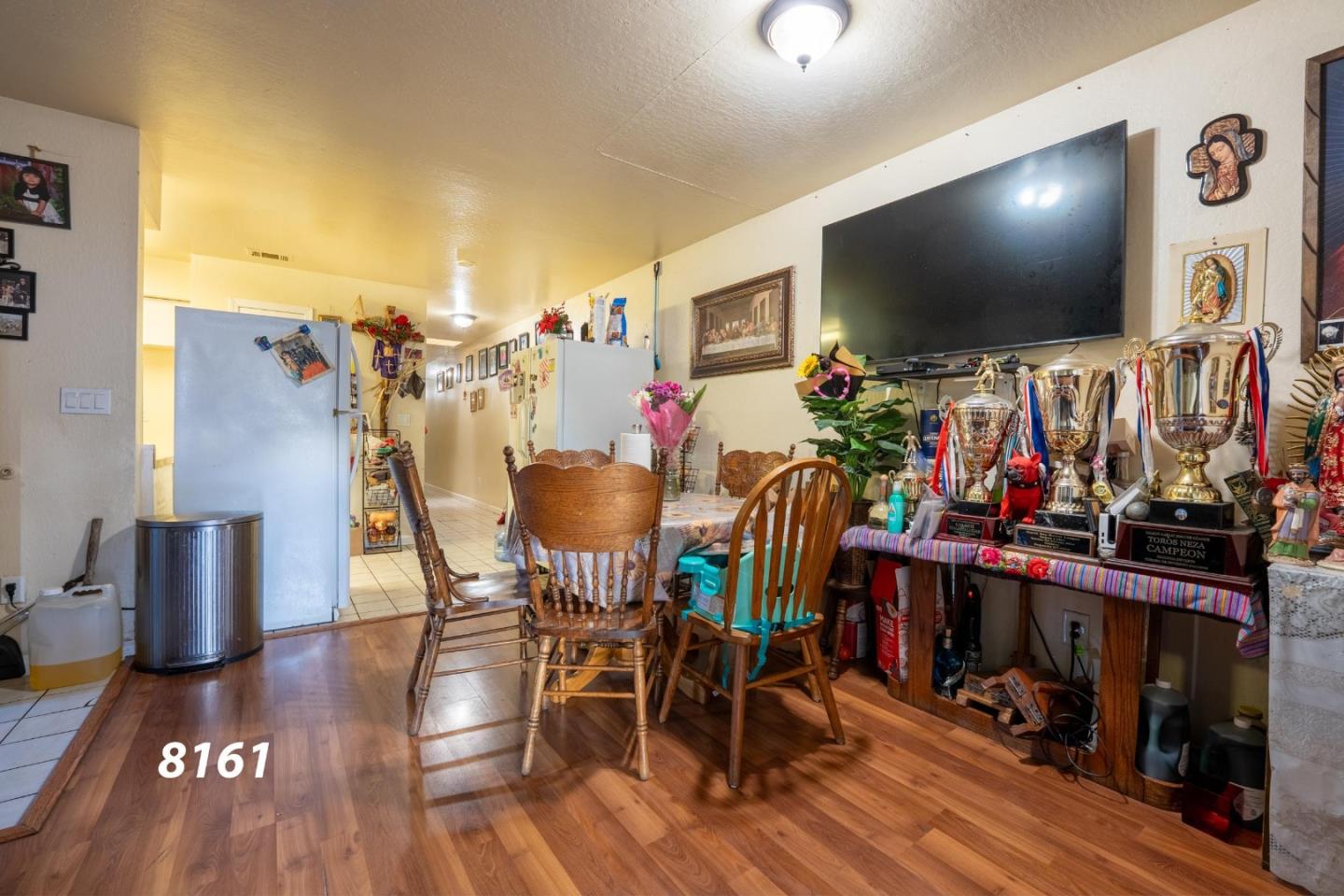 8151 Forest Street Gilroy, CA 95020 - Photo 5 of 43 a view of a dining room with furniture and wooden floor