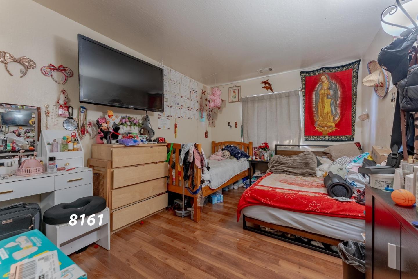 8151 Forest Street Gilroy, CA 95020 - Photo 10 of 43 a bedroom with furniture and a flat screen tv