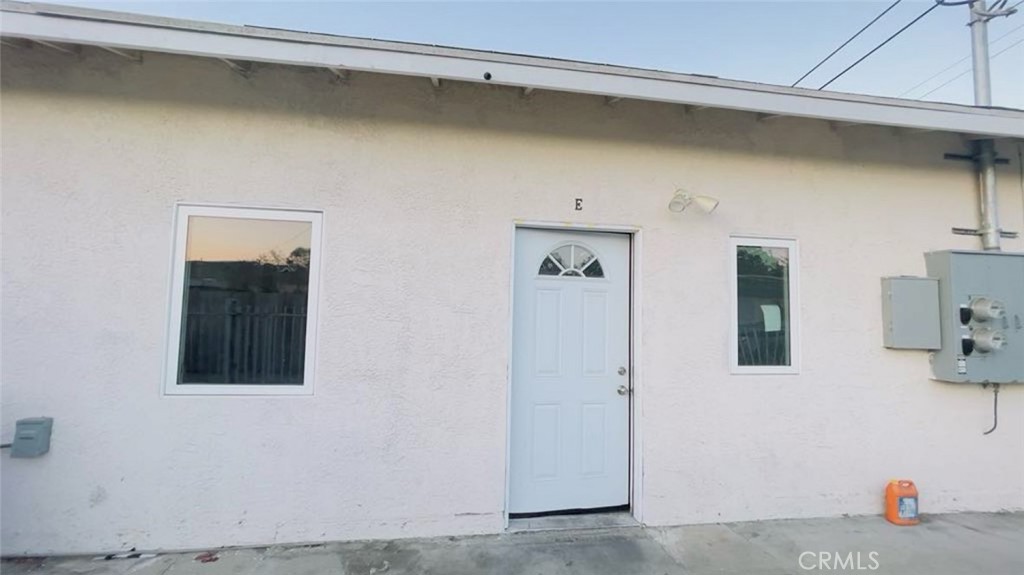 1458 West Summit Street, Unit E Long Beach, CA 90810 - Photo 1 of 7 a view of a door and a window