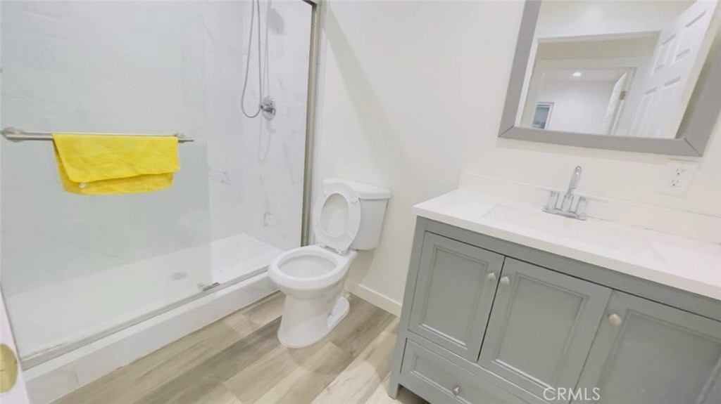 1458 West Summit Street, Unit E Long Beach, CA 90810 - Photo 5 of 7 a bathroom with a sink and a toilet