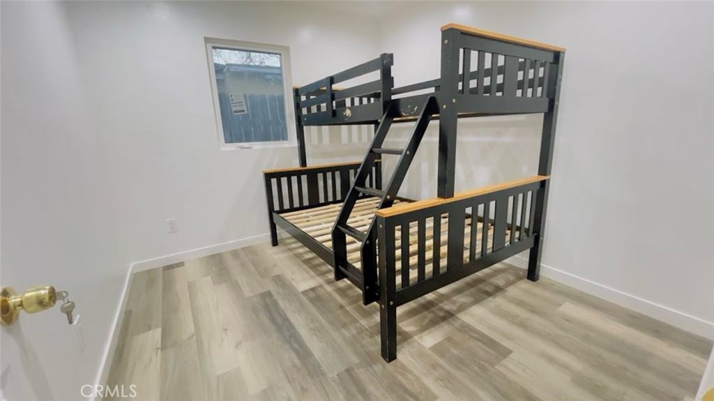 1458 West Summit Street, Unit E Long Beach, CA 90810 - Photo 7 of 7 a view of staircase with railing and white walls