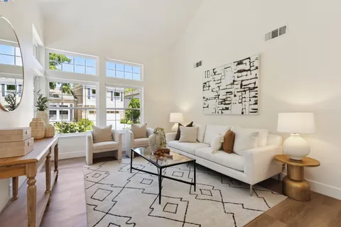 a living room with furniture and lamp