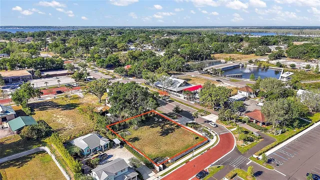 an aerial view of residential houses with outdoor space and swimming pool
