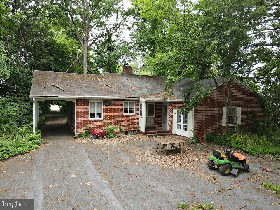 1733 Lancaster Road Manheim, PA 17545 - Photo 6 of 22 a front view of a house with a yard