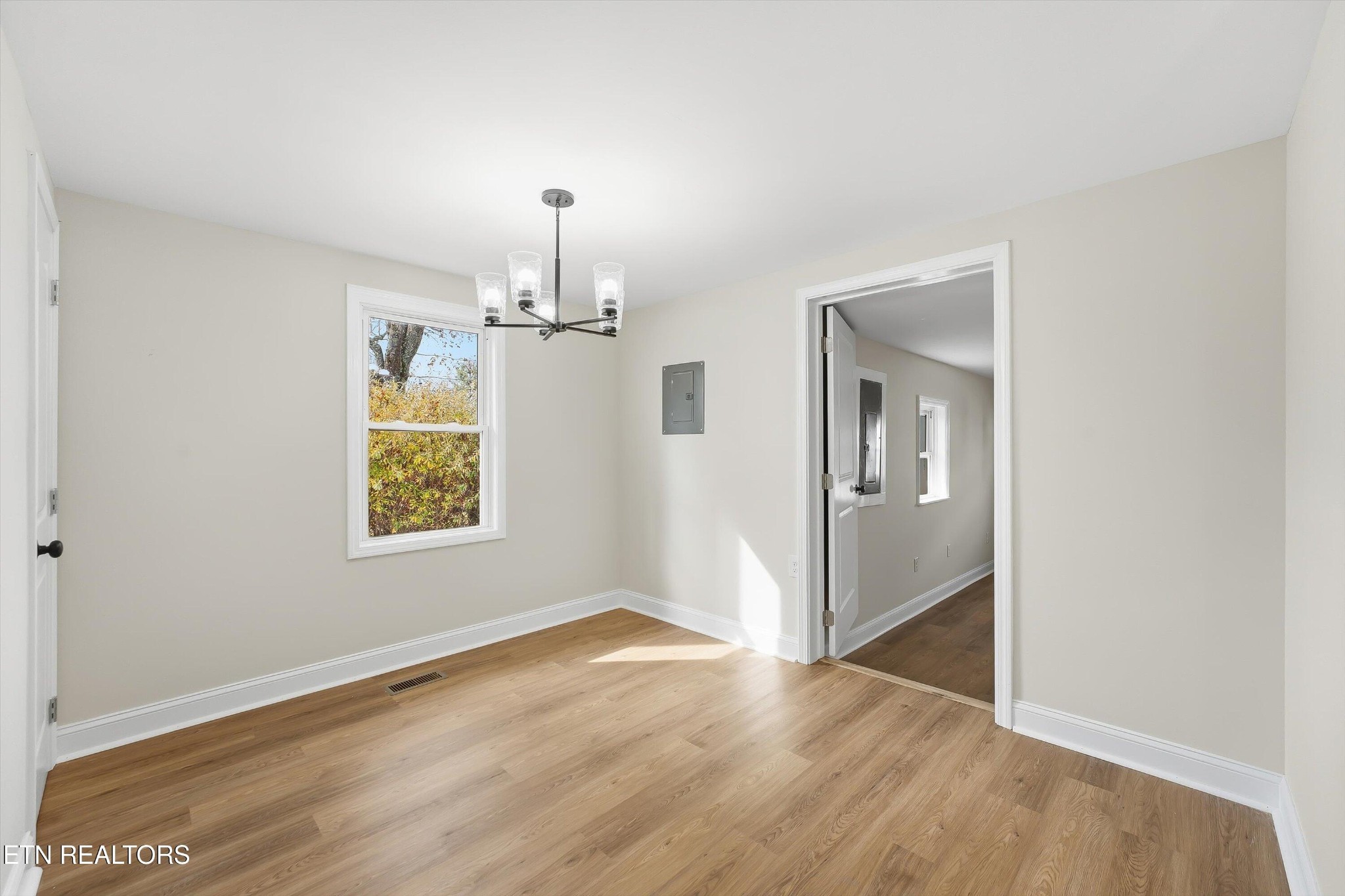 567 Dogwood Road Rockwood, TN 37854 - Photo 11 of 48 an empty room with wooden floor closet and windows