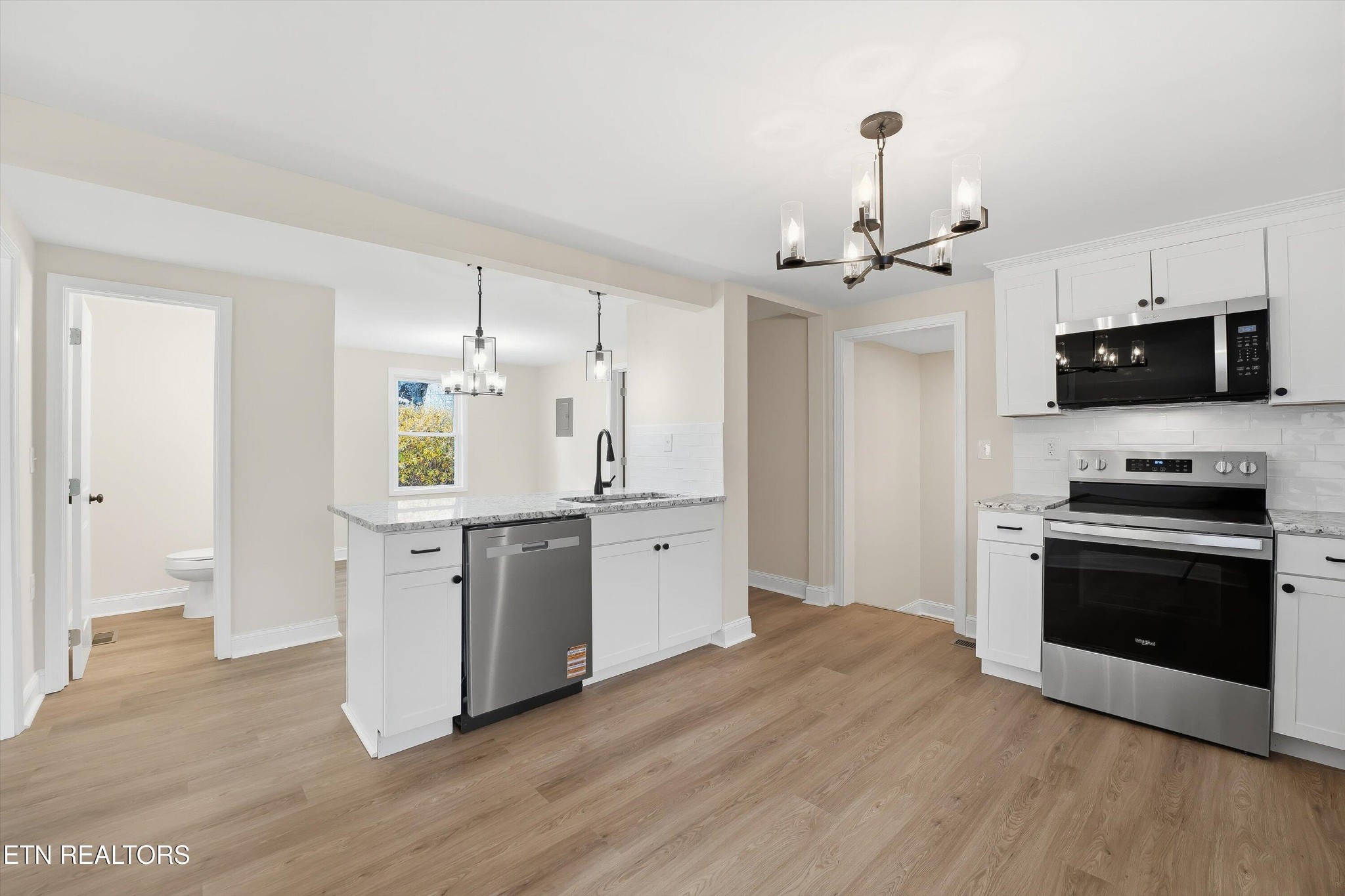 567 Dogwood Road Rockwood, TN 37854 - Photo 12 of 48 a kitchen with a refrigerator and a stove top oven