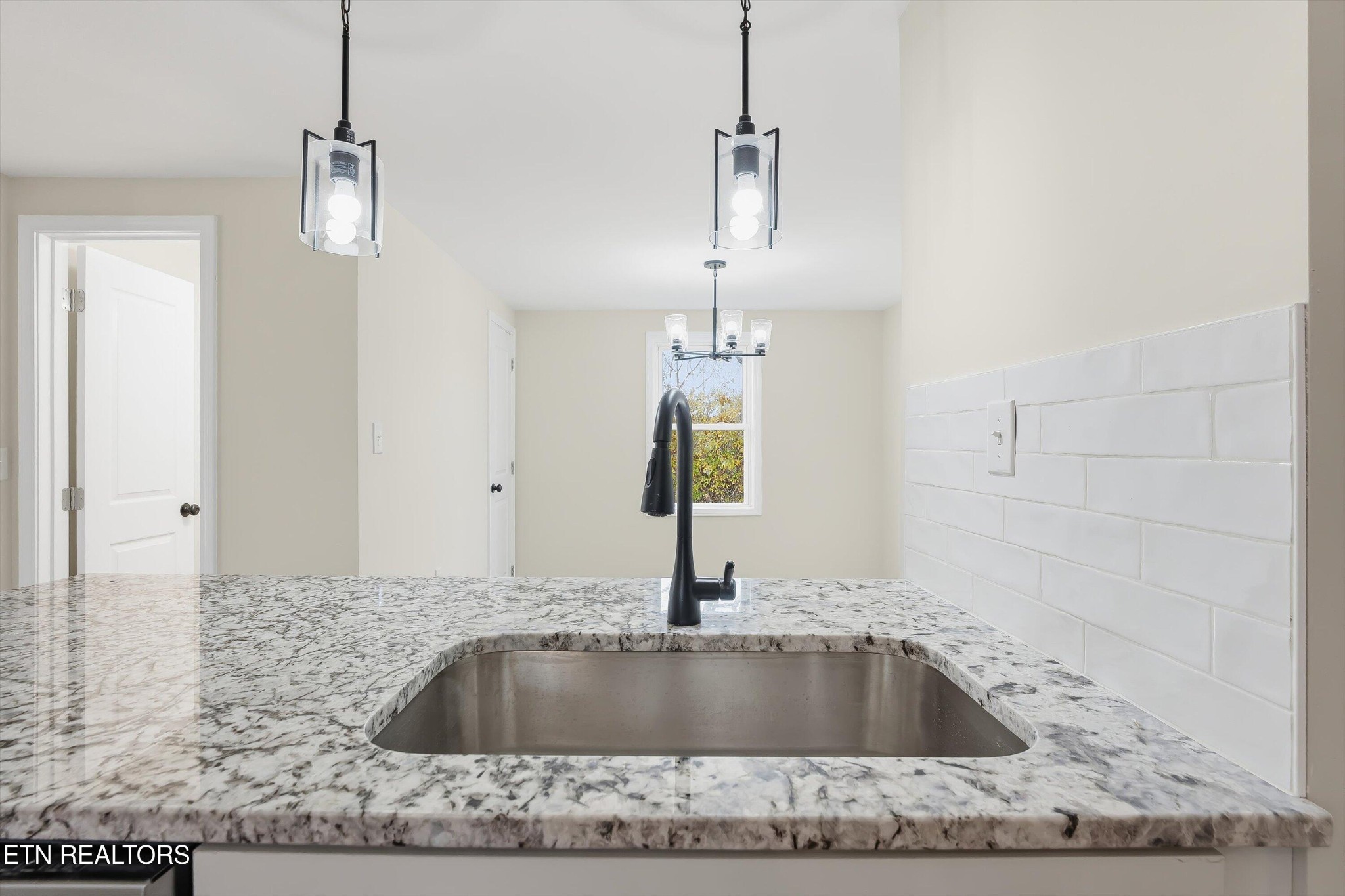 567 Dogwood Road Rockwood, TN 37854 - Photo 13 of 48 a kitchen with a sink granite counter top a window and couch