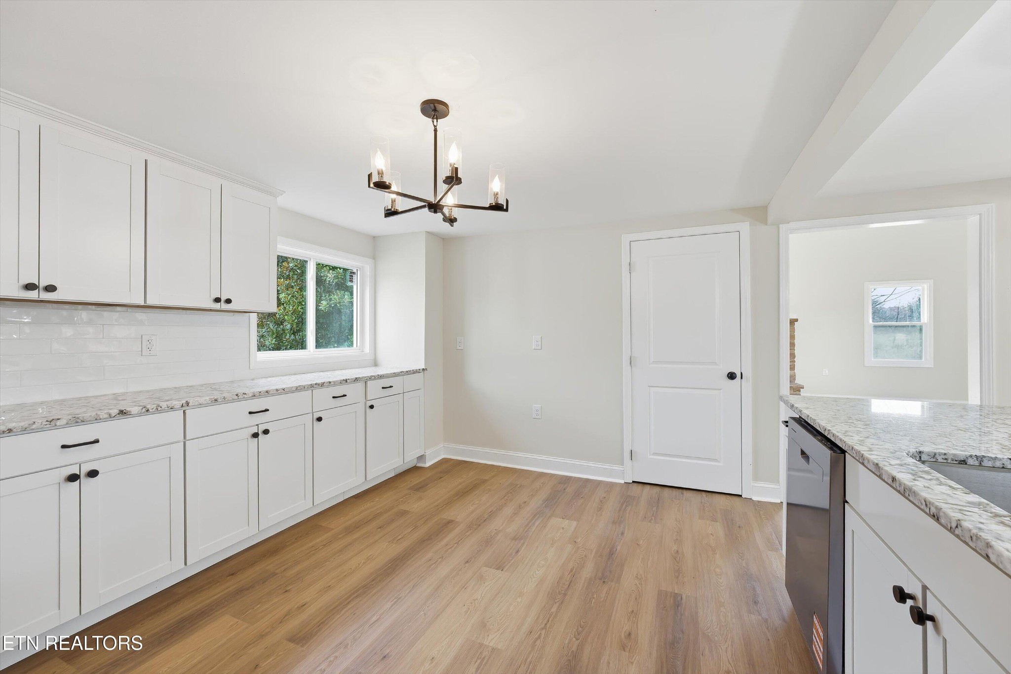 567 Dogwood Road Rockwood, TN 37854 - Photo 15 of 48 a kitchen with granite countertop white cabinets and white appliances