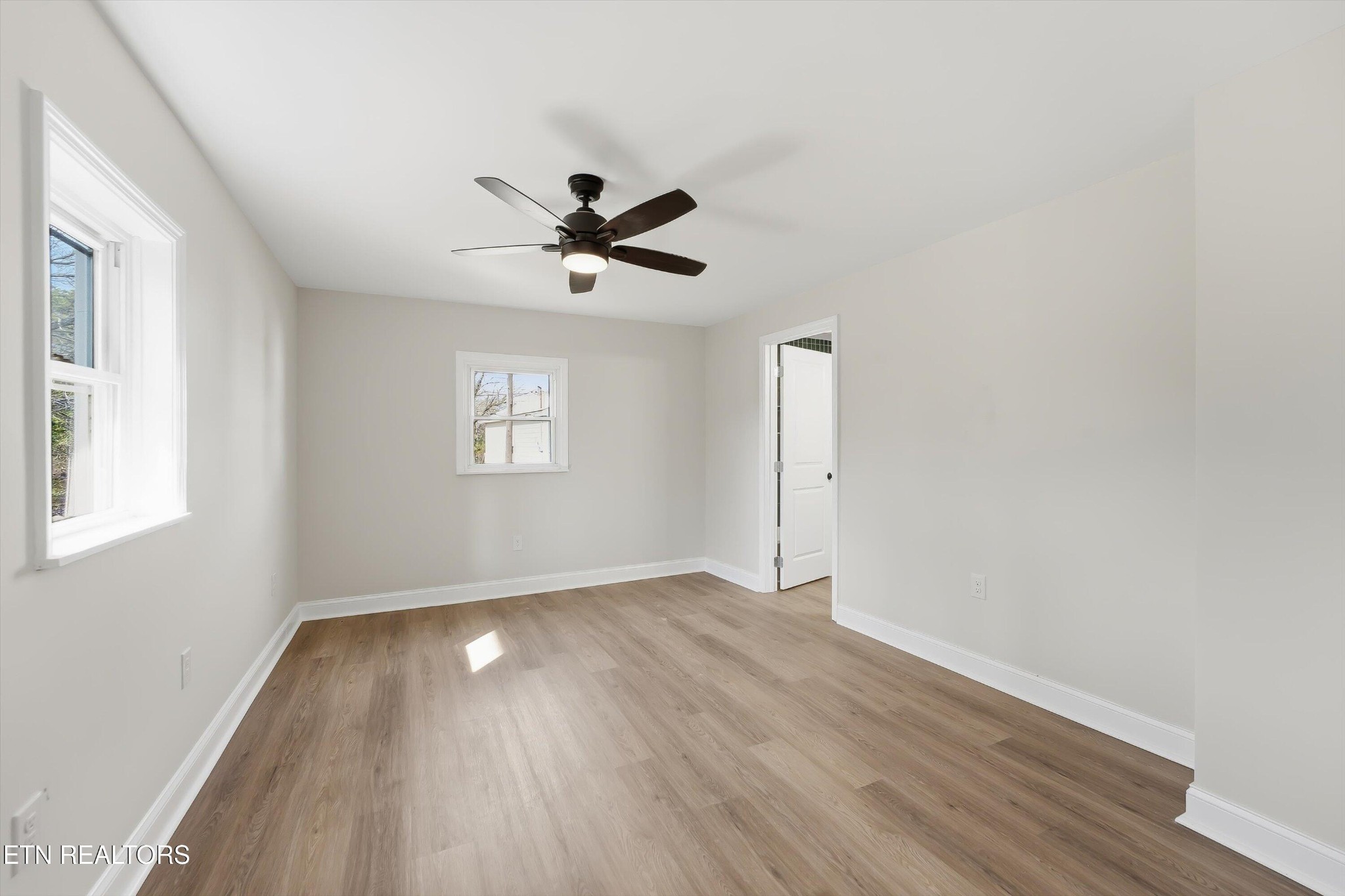 567 Dogwood Road Rockwood, TN 37854 - Photo 17 of 48 an empty room with wooden floor and windows